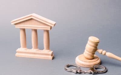 wooden-courthouse-and-handcuffs-400x250