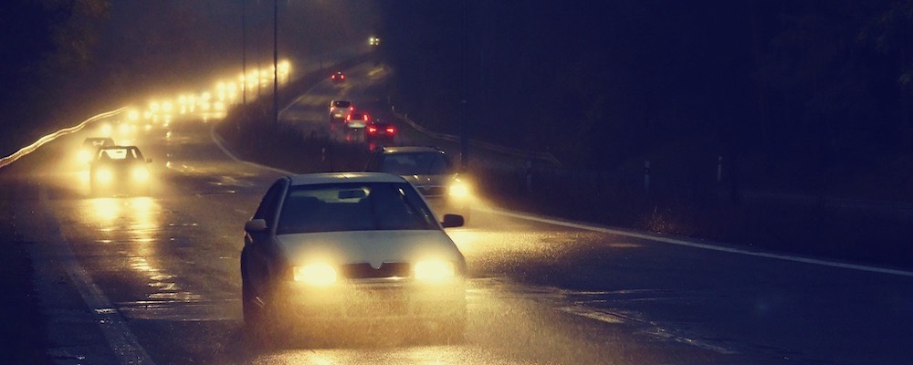 cars-driving-on-road-at-night